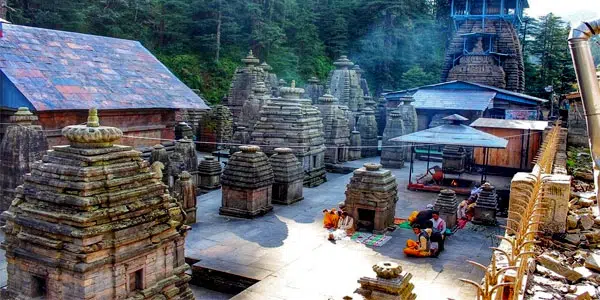 Jageshwar Temples surrounded by trees under a cloudy sky in the Indian  state of Uttarakhand Stock Photo by wirestock